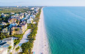 A beach with many buildings and people on it