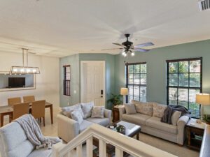 A living room with couches and tables in it